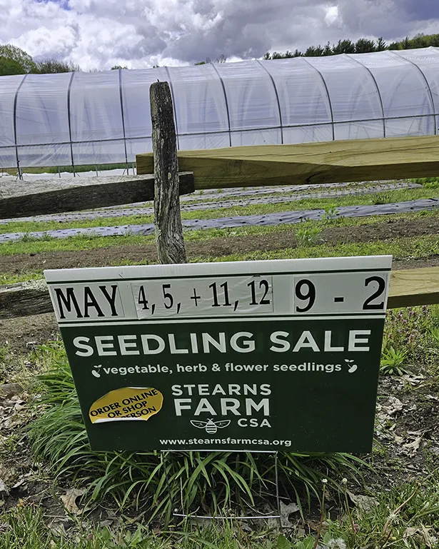 Sign on the farm showing 2024 seedling sale May 4,5, 11, 12 9 am to 2 pm